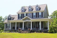 a gray house with white trim and black shutters