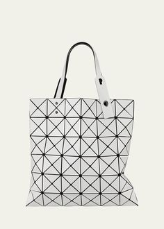 "Find ISSEY MIYAKE Lucent Tote Bag on Editorialist. The BAO BAO ISSEY MIYAKE \"Lucent\" tote bag is crafted from faux leather (PVC) and features a geometric design. It is lightweight and collapsible, making it easy to travel with. The tote has adjustable handles and a mesh lining. It also includes an interior zip pocket. The bag is easy to clean and can be wiped with a damp cloth. The bag measures 13.4 inches in height and 13.4 inches in width. It is made in Japan." Bao Bao Issey Miyake, Issey Miyake, White Bag, Womens Tote Bags, One Color, Geometric Design, Zip Pockets, Faux Leather, Tote Bag