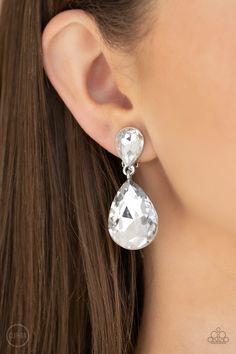 A dramatically oversized white rhinestone teardrop swings from the bottom of a smaller rhinestone teardrop, linking into a glamorous lure. Earring attaches to a standard clip-on fitting. Sold as one pair of clip-on earrings. P5CO-WTXX-106XX Jewelry Watch, Jewelry Show, Paparazzi Accessories, White Rhinestone, Paparazzi Jewelry, White Earrings, Earring Sale, Crystal Rhinestone, Clip On