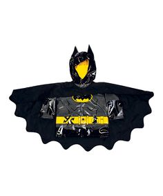 a child's batman costume is shown in black and yellow, with the bat on it