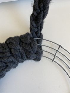 a close up of a piece of yarn on a wire