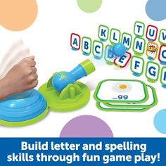 a child's hand is playing with the letters and spelling game, build letter and spelling skills through fun game play