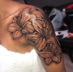 a woman's arm with flowers on it