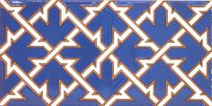 a blue and white tile with an orange design on the bottom half, in different directions