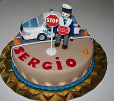 a cake with a traffic officer on top and a stop sign in the middle that says sergio