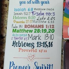 a sign with the names of different bibles on it next to some other items