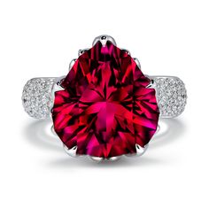 a red diamond ring with two diamonds around it