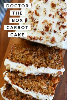 carrot cake with cream cheese frosting and pecans on top, sitting on a cutting board