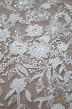 "Super Delicate Embroidery Flower Lace Fabric, Heavy Beaded Lace With Sequins, 3D Flowers Lace Fabric For Designer, Couture Bridal Lace The Lace Fabric is for 1 yard,You will receive the fabric in one continuous piece if you purchase more than 1 yard. ❤ ITEM INFORMATION Width about: 51inch (130Centimeters) Length : 91 Centimeters/ 1Yard Material: Beaded, Sequins, Rayon Yarn, Nylon Mesh Colors: Off-White,Transparent Sequins, Off-White Beaded NO: M8028 ❤ NOTE We offer special discounts for designe Luxury Cream Lace With Floral Embroidery, Luxury White Lace With Floral Embroidery, Luxury Lace Embroidered Fabric For Spring, Luxury Lace With Intricate Embroidery For Party, Luxury Embroidered Lace For Ceremony, Luxury Romantic Embroidered Lace Fabric, Luxury Embroidered Cream Tulle Fabric, Beaded Lace Fabric Bridal, Luxury Delicate Lace Embroidered Fabric