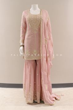 Ravishing attire to enhance your beauty. Be an angel and create and establish a smashing influence on anyone by wearing this light pink gharara outfit from palkhi fashion. Soft silk Top and palazzo pants highlighted with appealing embroidery, stones, resham, sequin weaving work, and handwork. Work enriched with enchanting & neat quality. A soft silk embroidery work dupatta accompanies this suit. Pink Chinon Sharara For Eid, Pink Chinon Sharara With Dabka Work, Pink Chinon Sharara For Diwali, Peach Suit Indian, Pink Raw Silk Palazzo Set With Chikankari Embroidery, Pink Chinon Palazzo Set With Mirror Work, Pink Silk Palazzo Set With Intricate Embroidery, Embroidered Pink Chinon Palazzo Set, Pink Embroidered Chinon Palazzo Set