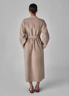 Full length coat in luxurious double faced wool cashmere. Tonal taupe contrast. Self Belt. Side seam pockets. 90% Wool, 10% Cashmere Taupe 6038BWCS-CORE Generous fit Total length XS/S = 52" M/L = 53" Model is 5'11" wears a size XS/S Wool Wrap Coat, Full Length Coat, Wrap Coat, Denim Shoes, Wool Coat, Dress Skirt, Sweater Shirt, Shirts Tops, Knitted Sweaters