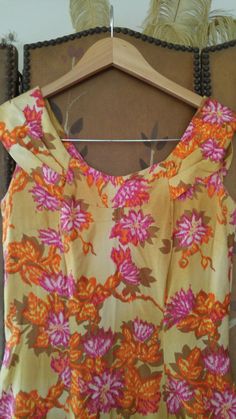 "Gorgeous 70s maxi Hawaiian dress in yellow ochre colour with orange and pink and mustard coloured flower print. The dress is long maxi length with fishtail hem which opens up in the middle between hem curtain. Fitted waist and bust. Collar goes around and over shoulders and ends at the back in two pointed 'collars. Zip up at back. Made by Liberty House, made in Hawaii, Kailua, Downtown Waialae By Hawaiian Casuals arm hole to arm hole 17\" (bust 34) waist 28\", hips 34\", dress length 55\"" Fitted Mustard Maxi Dress With Floral Print, Pink And Mustard, Liberty House, Yellow Ochre, Cute Notes, Hawaiian Dress, Orange And Pink, Decorative Trim, House Made