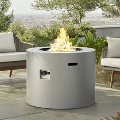 a fire pit sitting on top of a patio