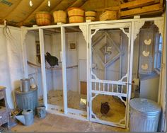 the inside of a chicken coop with chickens in it