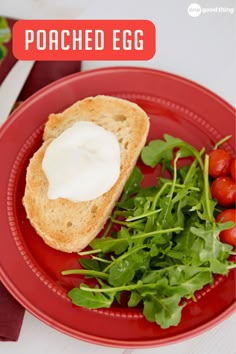 a red plate topped with bread and salad