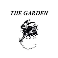 the garden book cover with an image of a witch riding a cat on it's back