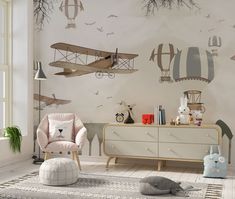 a child's room with an airplane wall mural