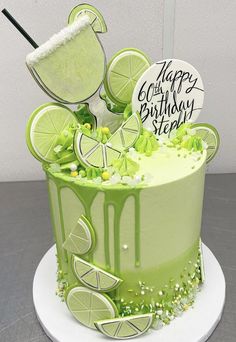 a birthday cake decorated with limes and marshmallows