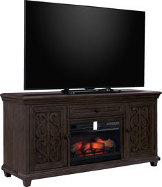 an entertainment center with a fireplace and flat screen tv on top of the entertainment center