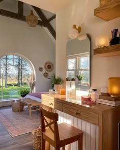 a living room filled with furniture and a large window