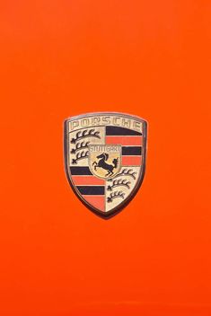 the emblem on an orange car is shown