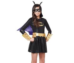 DC Comics Child Batgirl Halloween Costume, New Large 10-12. Your little girl will love traveling house to house collecting only the best candy in this Batgirl costume. Long sleeved dress features a metallic Batgirl logo that will have your little one shining all night long. Attached hood features sequined ears that match the sequined skirt perfectly. detachable cape has a purple lining that will add a splash of color to the outfit. Add the included arm band, belt, and glitter mask for the ultima Batman Girl Costume, Batgirl Halloween, Batgirl Halloween Costume, Batgirl Logo, Batman Party Decorations, Halloween Halloween Costumes, Glitter Mask, Halloween Costume Black, Batman Halloween