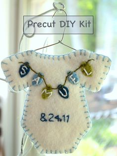 an ornament hanging from a window with the words precut diy kit on it