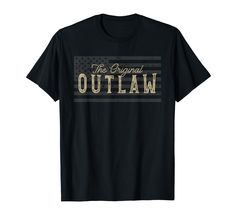 PRICES MAY VARY. Vintage Style Outlaw and American Flag Design. Weathered Vintage Design - Perfect for Wild West, Western, Cowboy, Country, Bikers and Old Outlaw Movie Fans Featuring large weathered American flag with vintage style text Lightweight, Classic fit, Double-needle sleeve and bottom hem American Flag Design, Vintage American Flag, Cowboys Shirt, Flag Design, Western Cowboy, Wild West, Buy Vintage, Branded T Shirts, Vintage Design