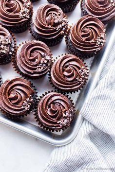 chocolate cupcakes on a baking sheet ready to be eaten