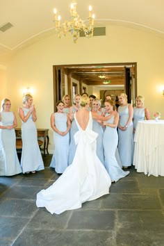 a bride and her bridal party posing for the camera