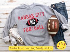 "This Kansas City sweatshirt is a perfect gift to celebrate your team! Wear your Chiefs shirt with pride and fight for your right to party! Available in matching shirts for the whole family! We are woman-owned, and design, print, and ship in the USA. Our eco-friendly inks are water-based, bio-degradable and non-toxic - which means they are safe for you and all your favorite people. Size chart: Adult sweatshirt (actual garment measurements. To estimate to your chest size, multiple width by two (ex. Medium fits up to 44\") WidthLength Small20\"27\" Medium22\"28\" Large24\"29\" XL26\"30\" 2X28\"31\" 3X30\"32\" 4X32\"33\" Shipping: Free shipping on $35+ orders! Standard shipping is USPS First class shipping $8.99 for one item, $4.99 for each additional item. Returns: Each item is printed just Chiefs Sweatshirt, Chiefs Shirt, City Sweatshirt, Kc Football, Matching Family T Shirts, Chiefs Shirts, Kc Chiefs, Football Sweatshirt, Team Wear