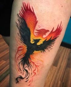 a bird with red and yellow wings is on the leg, while it appears to be painted