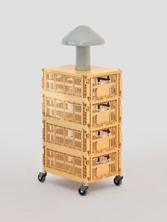 a stack of crates sitting on top of each other in front of a white background