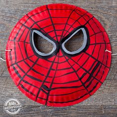 a paper plate with a spiderman mask on it