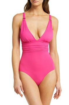 Look sophisticated enough for a European island retreat in this one-piece swimsuit—its soft ruching flatters curves and makes it ideal for larger bust sizes. Golden bar hardware at the adjustable straps adds a touch of glam shine. Adjustable straps Removable soft cups Medium coverage Lined 91% polyamide, 9% elastane or 80% polyamide, 20% elastane Hand wash, line dry Made in Italy Women's Active & Swim Elegant Pink V-neck Swimwear, Elegant Pink Swimwear With Lined Body, Elegant Pink Lined Swimwear, Elegant Pink Swimwear For Pool, Pink Ruched Swimwear For Swimming, Elegant Pink Swimwear For Summer, Pink Ruched One-piece Swimwear, Elegant Pink Swimwear For Beach Season, Pink Ruched Beachwear Swimwear