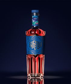 a bottle of sir 10 is sitting on a reflective surface in front of a dark background