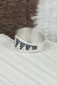 This sterling silver ring was made by Hopi silversmith Timothy Mowa. The inside is stamped sterling.Size: 12Length: 1"Free shipping on all orders! We ship with USPS and always include tracking. All orders ship within a day of payment.Returns are accepted up to 30 days after you receive your order. Just send us a message. Our shop offers cash back or store credit. The item must be returned in new condition. Artisan Sterling Silver Wide Band Ring, Artisan Engraved Sterling Silver Ring 925, Unique Silver Ring With Inlay, Silver Sterling Silver Signet Ring, Sterling Silver Inlay Ring, Sterling Silver Inlay Ring For Anniversary, Native American Jewelry, Free Jewelry, Sterling Silver Ring