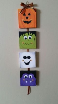 four halloween bags hanging on the wall