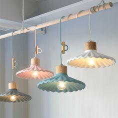 three different colored lights hanging from the ceiling