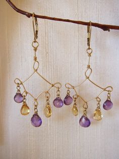 Curling with Color, these 14K Gold Filled Hand Twisted Earrings dripping with Purple Amethyst and Citrine are as regal as they are innocent.  These Earrings are approximately 2 3/4" long measured from the top of the ear wire.All pieces come in jewelry boxes and are completely gift ready.Thank you for visiting my shop.Item No. GFE102 Chandelier Jewelry, Twisted Earrings, Amethyst And Citrine, Twisted Wire, Jewellery Ideas, Solid Gold Jewelry, Wire Earrings, Jewelry Boxes, Gold Filled Jewelry