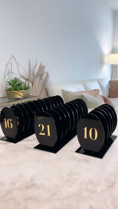 black and gold numbered table numbers on marble surface