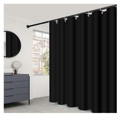 a black shower curtain hanging on the side of a bathroom wall next to a mirror