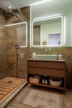 A light green bathroom paired with brown tiles and cabinetry, showcasing a fresh, clean aesthetic. Light Green Bathroom Ideas, Light Green Bathroom, Light Green Bathrooms, Green Bathroom Ideas