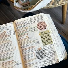 an open bible sitting on top of a table