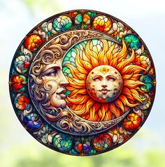 the sun and moon are depicted in this colorful stained glass art piece, which is hanging on a wall