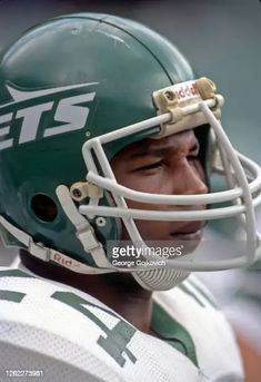 the new york jets'head coach looks on during an nfl football game