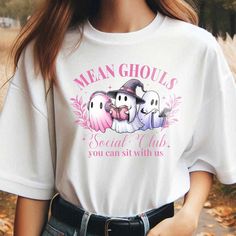 Mean Ghouls Social Club Shirt, Ghost Shirt, Halloween Shirt, Pink Ghost T-shirt, Girls Club Shirt, Let's Go Ghouls, We Wear Pink Shirt -------------------------------------------------------------------------------------------------- 🌟 🌟 🌟 🌟 🌟 🌟 🌟 🌸 Material: - Made of 50% cotton and 50% polyester. - Medium-heavy fabric. - True to size. - Unisex design fits like a traditional semi-fitted men's t-shirt but looks great on both men and women. Men should order their usual size or size up for a looser fit. - For detailed sizing and color options, please refer to the listing images. - Actual colors may vary due to differences in monitor and screen displays. Please note that colors may slightly differ from screen to printed product. - A funny shirt ideal for fathers, brothers, dads, boys, Casual Anime Print Top For Halloween, Halloween Anime Print Crew Neck T-shirt, Halloween Cotton Top With Anime Print, Halloween Anime Print Cotton T-shirt, White Tops With Anime Print For Halloween, Cotton Anime Print T-shirt For Halloween, White Anime Print Top For Halloween, Cute Halloween T-shirt For Streetwear, Mean Ghouls