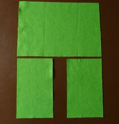 the pieces of green paper are cut into squares and placed on top of each other