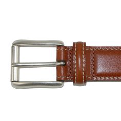 Italian vegetable dyed smooth calfskin features a natural vegetable dyed leather lining for a full genuine leather belt. The solid brass buckle has a silver tone and features a roller. Expertly stitched with contrast thread, this item is made by hand in America. Made of Italian Vegetable Dyed Calfskin Formal Leather Belt Buckles In Cognac, Classic Brown Bridle Leather Belt, Formal Cognac Leather Belt Buckles, Classic Business Belt In Bridle Leather, Classic Bridle Leather Business Belt, Classic Bridle Leather Belt For Business, Brown Leather Rectangular Belt Buckles, Classic Brown Leather Belt Buckles, Classic Cognac Belt Buckle