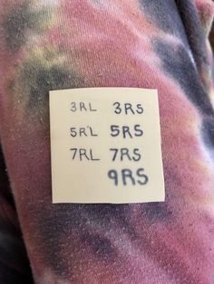 a tie dye shirt with a price tag on it that says 3rl 3rs